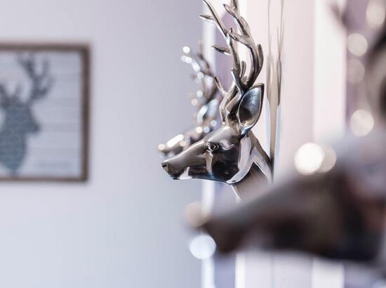 Close-up of decorative stag heads.