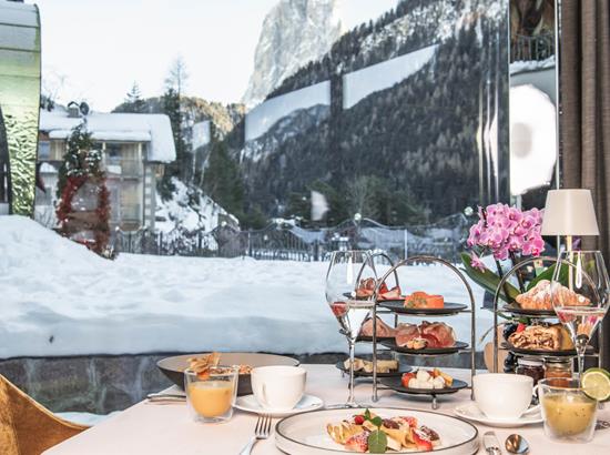 Brunch with a view on the Dolomites in winter